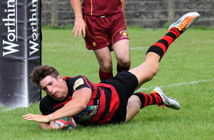Mauritz Neumann scores a try for Tenby United
